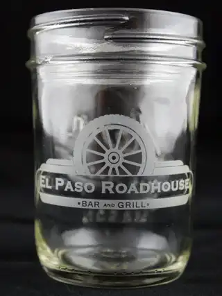 Glass mason jar etched with El Paso Roadhouse artwork