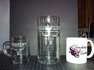 Collection of custom etched and sublimated drinkware