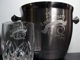 EC Plumbing logo etched into glass and metal