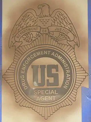 Completed glass etching featuring a DEA shield