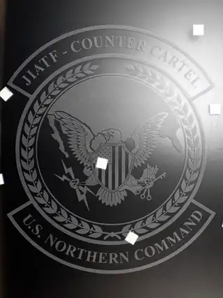 Completed Joint Interagency Task Force Counter Cartel crest etched in glass