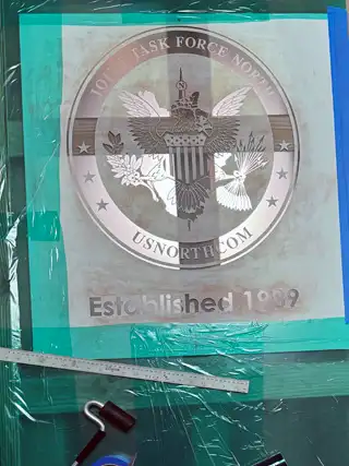 Completed Joint Task Force North design etched in glass