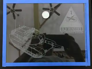 M1 Abrams tank and 1st Armored Division artwork etched into glass