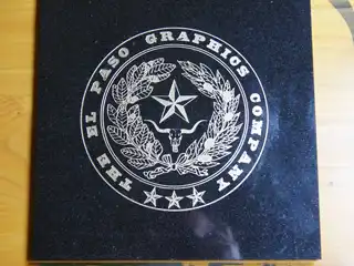 El Paso Graphics Company logo etched into granite with gold color fill