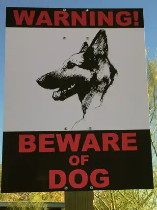 Custom Beware of Dog sign featuring an illustrated portrait of Athena